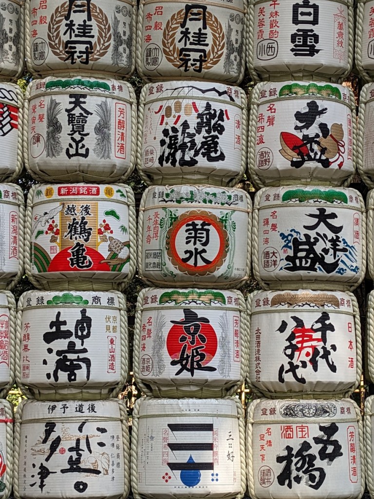 beautifully-decorated-sake-barrels-stacked-high-at meiji-jingu-tokyo