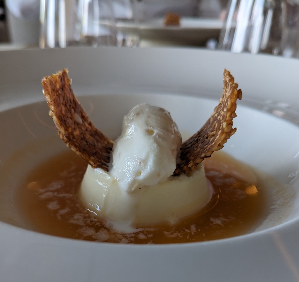 Vanilla-white-panna-cotta-on-sesame-ice-cream-with-viking-horn-style-goro-at-the-chefs-table-on-viking-venus