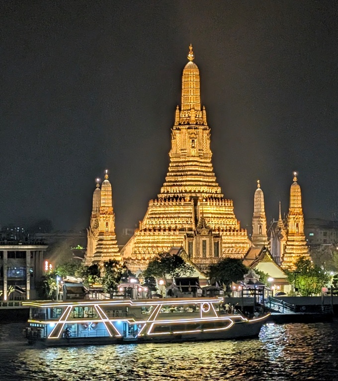 Wat Arun at night on the banks of the Chao Phraya River, Bangkok