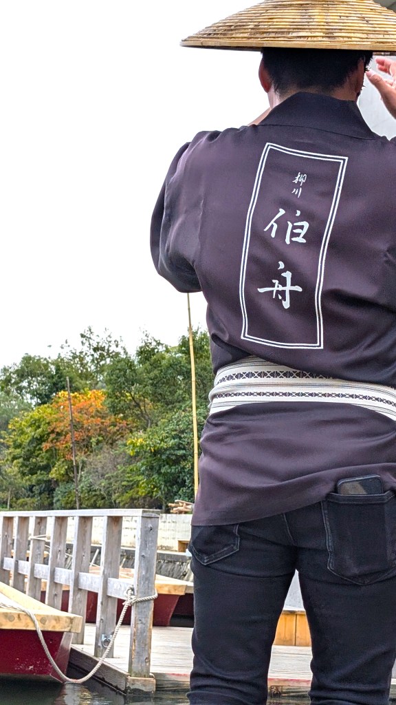 The-boatman’s-skillful-handling-of-the-pole,-lively-stories-and-songs-add-to-the-atmosphere-of-a-Yanagawa-River-Cruise