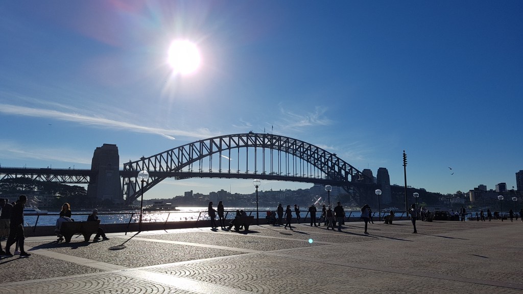 The iconic Harbour Bridge in Sydney, New South Wales makes a grand statement as it arches majestically over Sydney Harbour on a warm sunny winters day